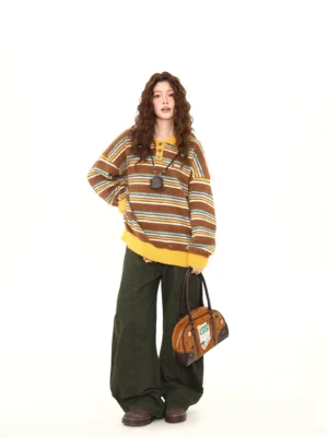 Female model wearing a brown striped fuzzy knit polo sweater with yellow collar and cuffs, dark green wide-leg pants, leather shoes, and vintage handbag in a retro streetwear outfit