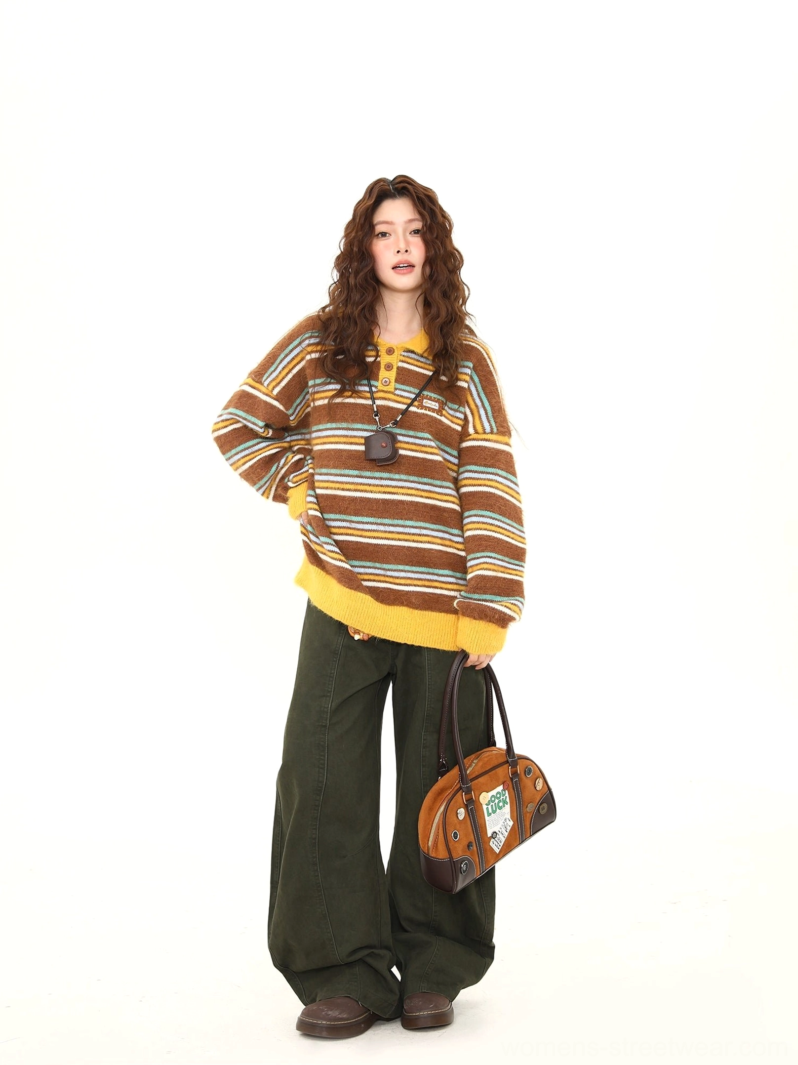 Female model wearing a brown striped fuzzy knit polo sweater with yellow collar and cuffs, dark green wide-leg pants, leather shoes, and vintage handbag in a retro streetwear outfit