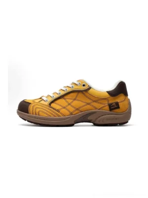 Left side profile view of retro colorblock German trainer sneaker with yellow upper and brown toe cap, showing stitched grid texture and vintage runner sole design
