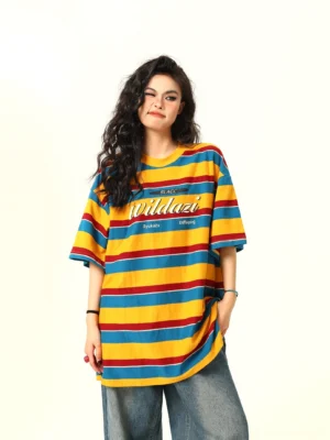 Front view of a retro yellow red and teal striped oversized streetwear T-shirt styled with wide-leg vintage jeans