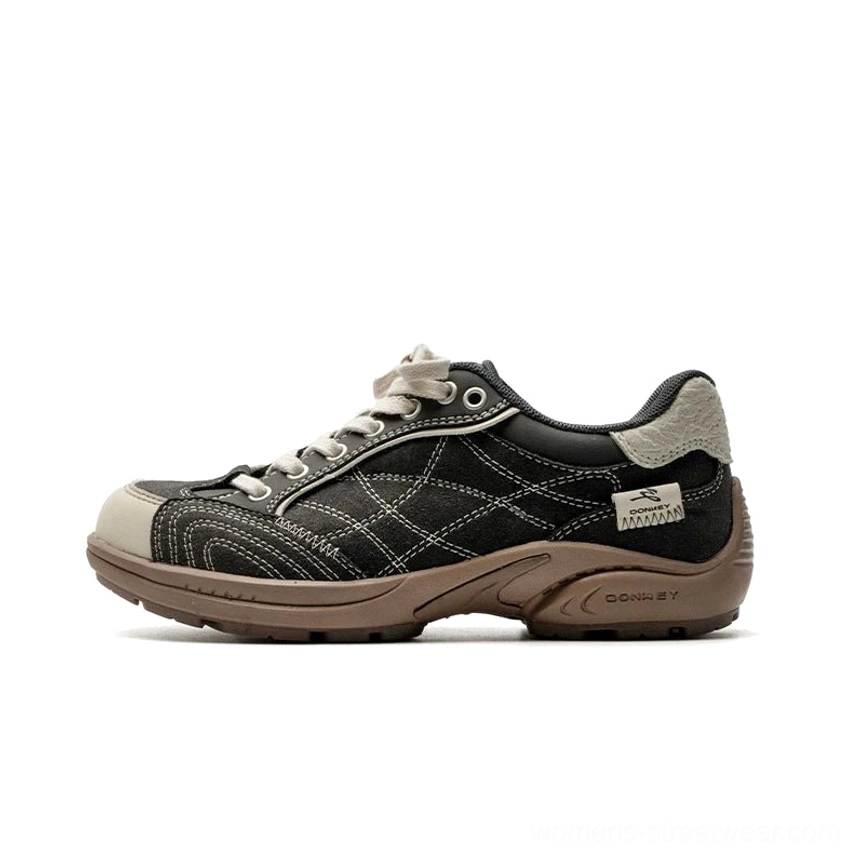 Black and beige retro cross-stitch low-top runner sneakers with contrasting brown outsole