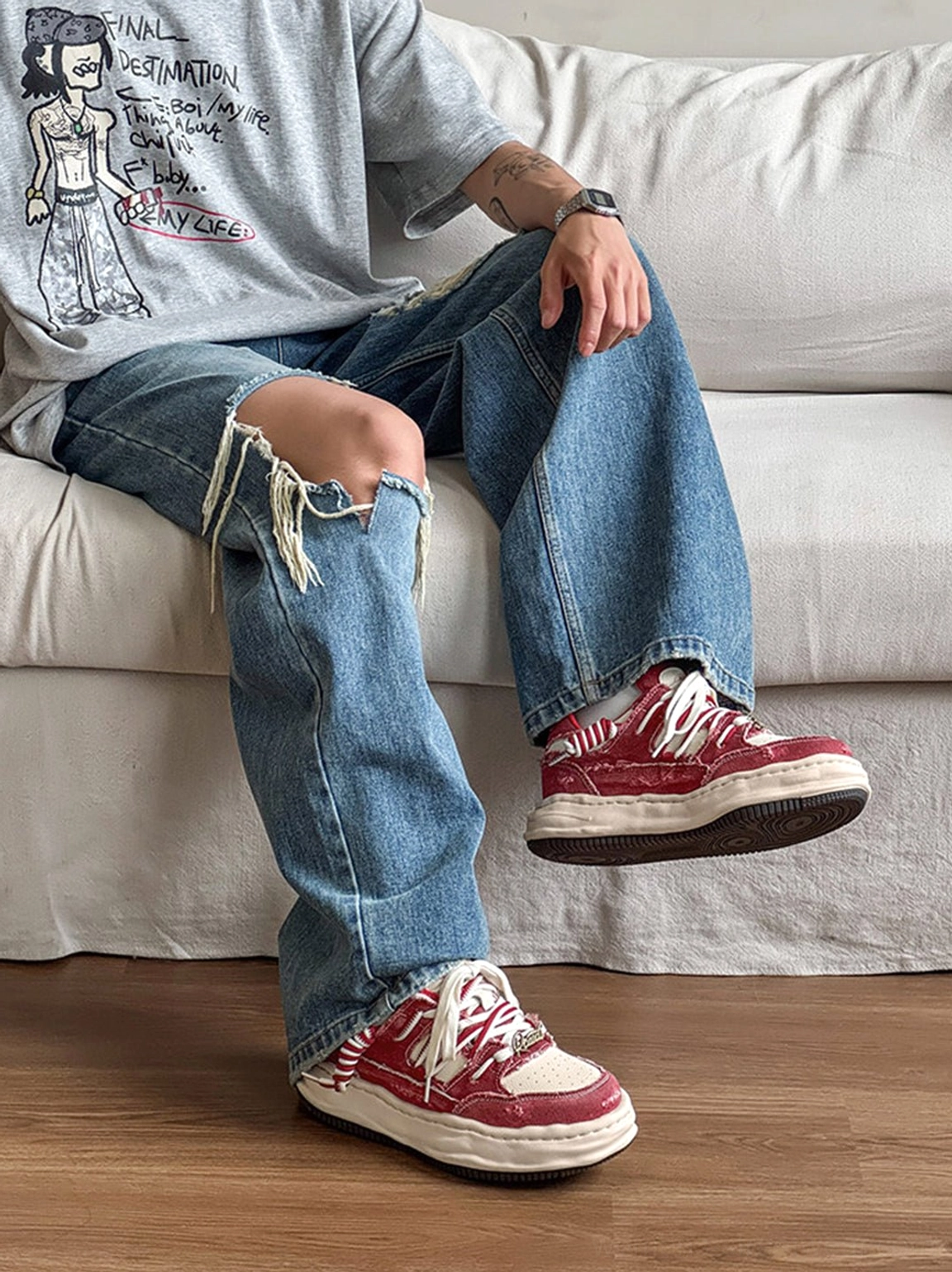 Retro denim-effect chunky sneakers with detailed laces and cream outsole worn with ripped baggy jeans and a graphic tee