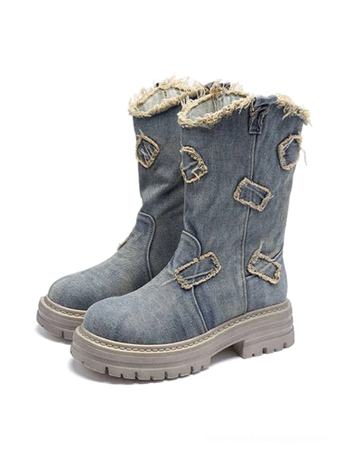 Retro distressed denim platform boots with star cutouts, frayed mid-calf shaft, and chunky rubber lug sole for streetwear outfits