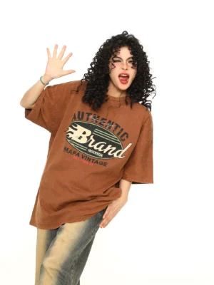 Brown retro flame washed oversized streetwear T-shirt worn with wide-leg jeans front three-quarter view