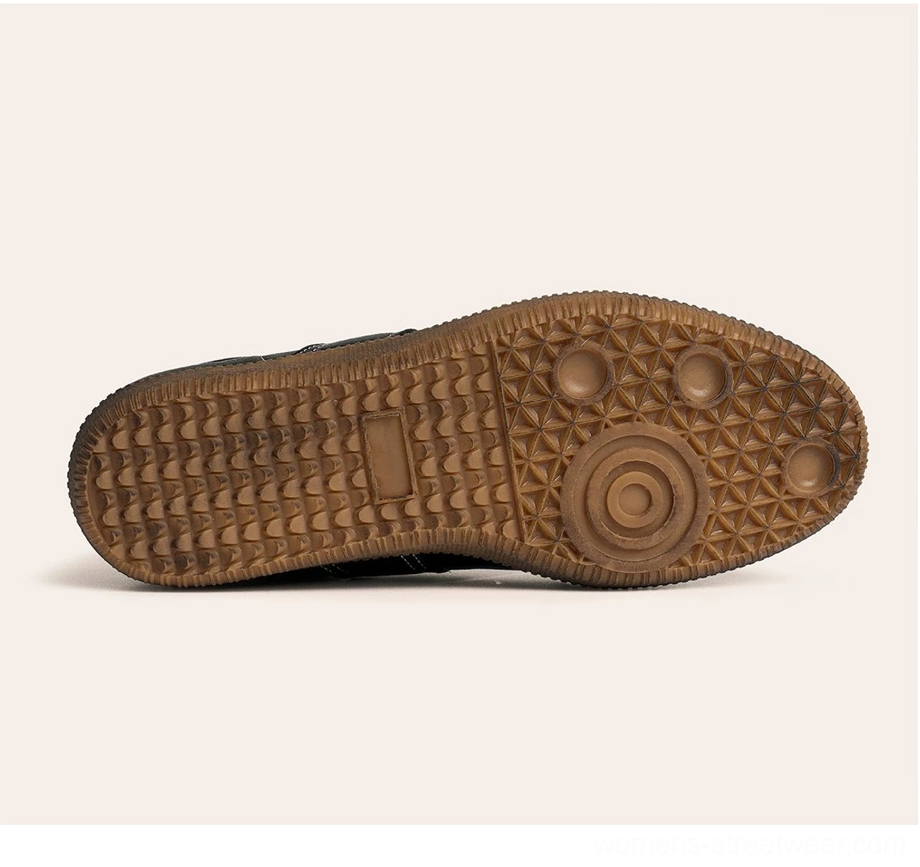 Bottom view of black retro German army leather sneaker showing patterned non-slip brown gum rubber outsole