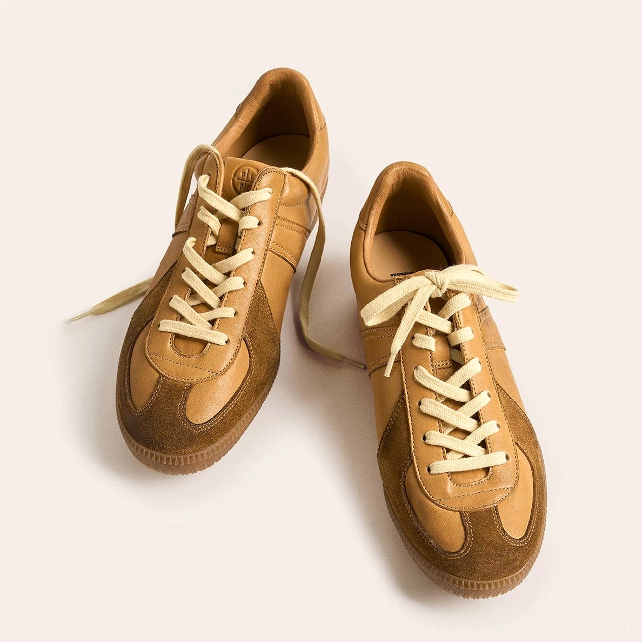 Low-profile retro German army leather sneakers designed for vintage streetwear outfits
