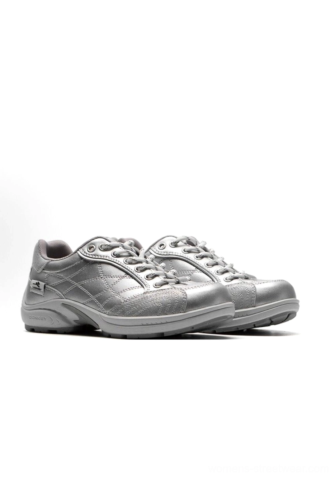 Gorpcore aesthetic product display of retro colorblock German trainer sneaker styled with technical outdoor-inspired streetwear elements