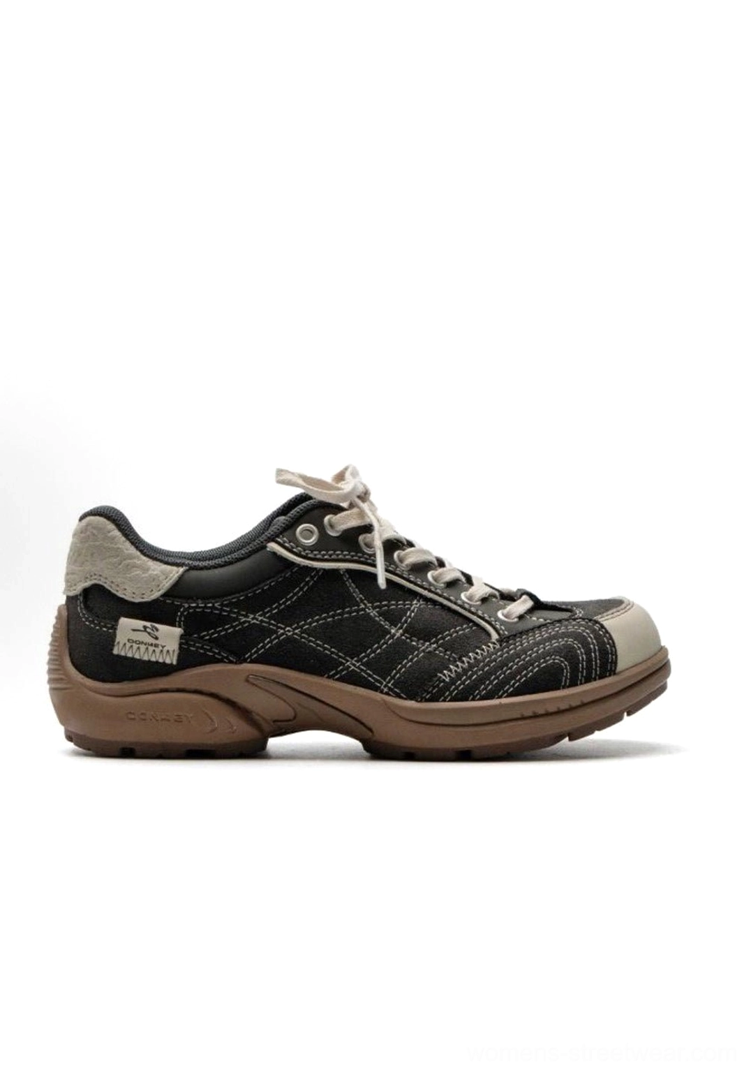 Brand heritage storytelling photography of retro colorblock German trainer sneaker celebrating European sportswear design legacy and evolution