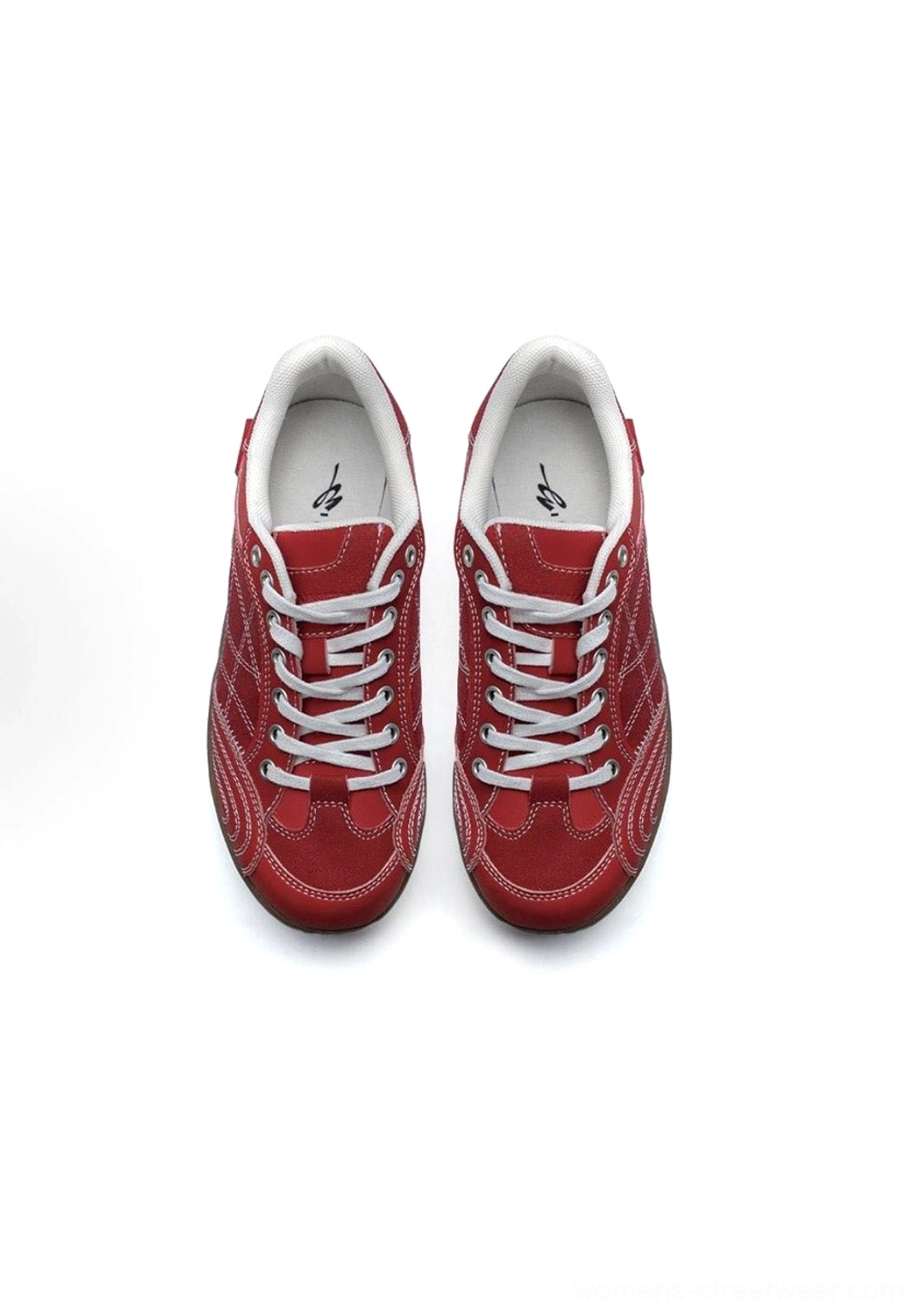 Upper textile and synthetic blend detail shot of retro German trainer sneaker displaying material quality and colorblock overlay architecture