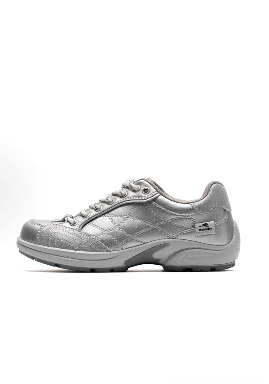 Y2K nostalgia fashion photography featuring retro colorblock German trainer sneaker with vintage-inspired outfit and early 2000s styling