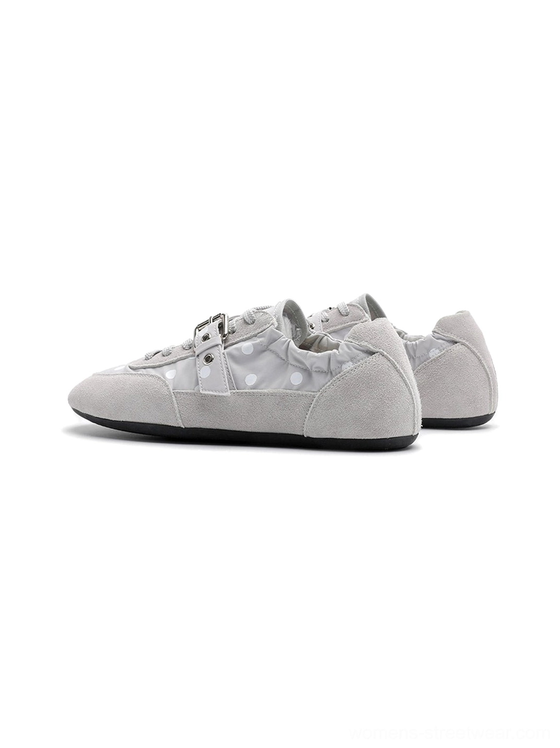 Retro-inspired low-profile polka dot sneakers combining ballet flat styling with a practical lace-up closure