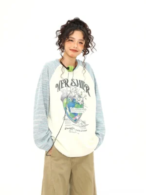 Apricot retro planet raglan long sleeve graphic tee styled with khaki wide leg pants front full body streetwear view