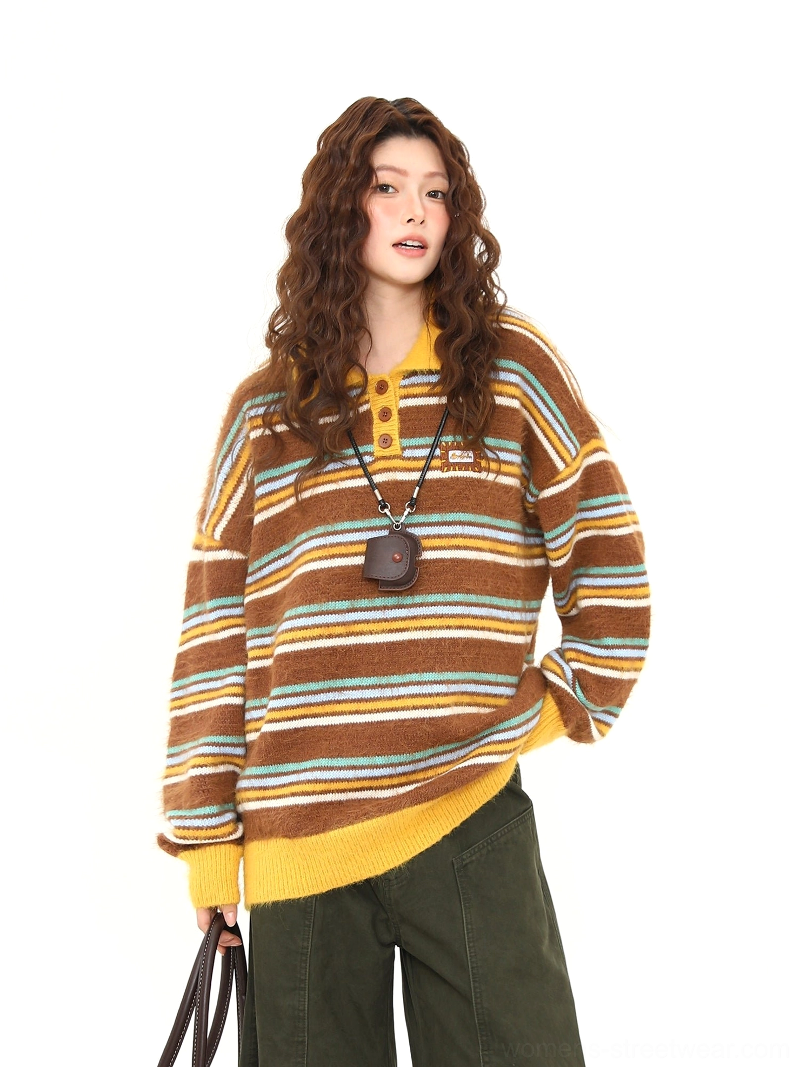 Close-up front view of a retro striped fuzzy knit polo sweater showing the Henley button placket, contrast yellow collar, textured knit, and small chest badge