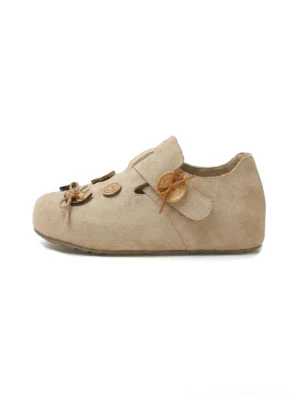 Brown suede-look button strap two-way slip-on shoes with rounded toe and decorative wooden-style buttons