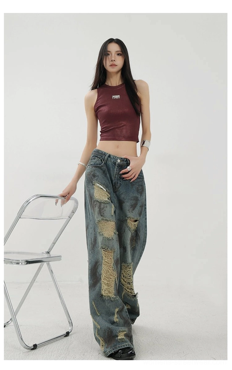 Retro washed blue wide-leg jeans featuring frayed ripped details and expressive Korean streetwear denim design