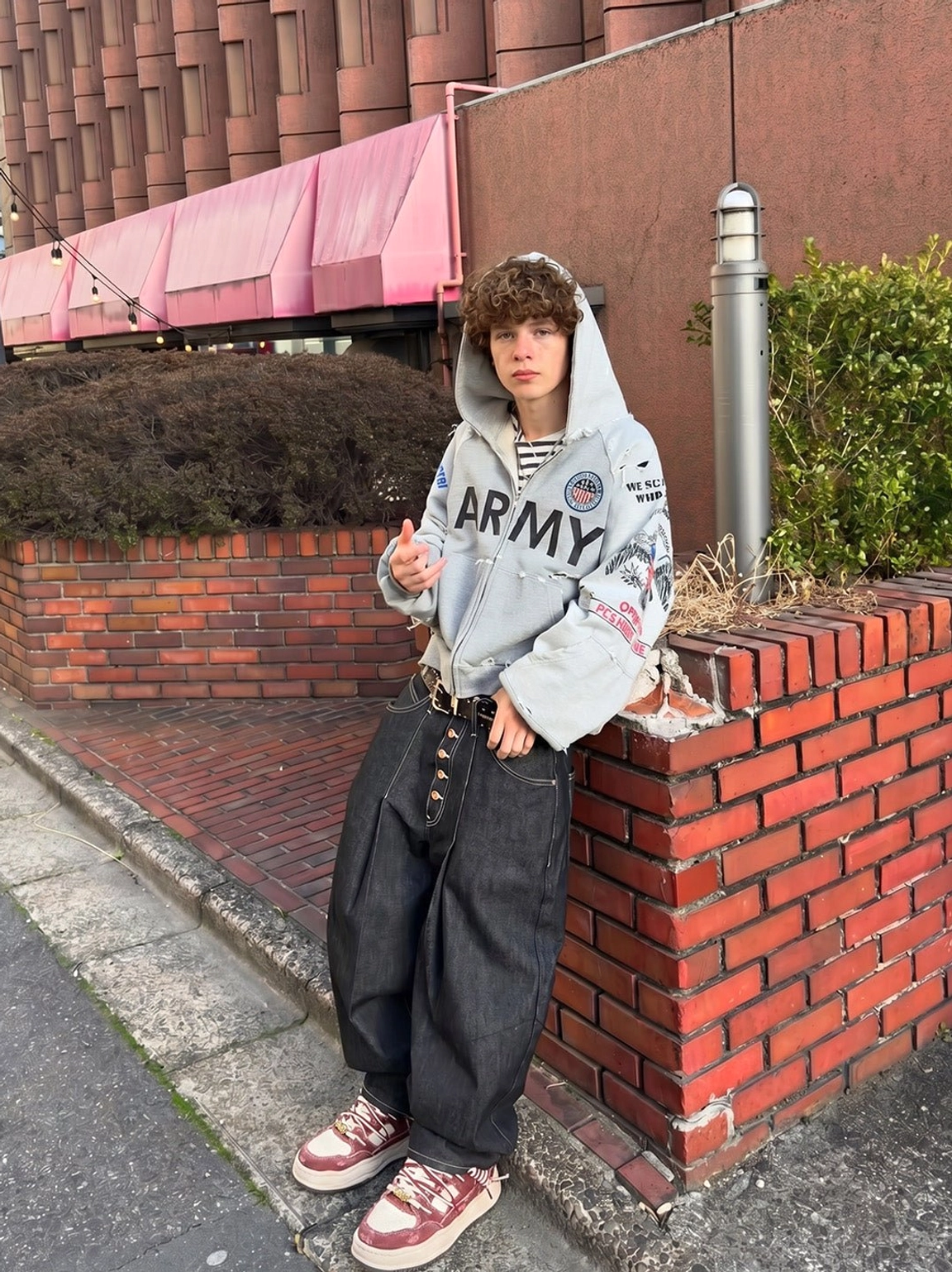 Retro washed denim sneakers with chunky cream soles worn with loose black denim in a casual streetwear setting