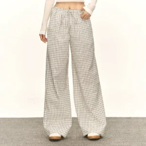 White retro plaid drawstring wide-leg streetwear lounge pants shown in a front full-length studio view
