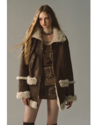 Front full-body view of a reversible dark brown suede shearling jacket with cream trims, vintage buckle straps, and oversized Y2K streetwear styling