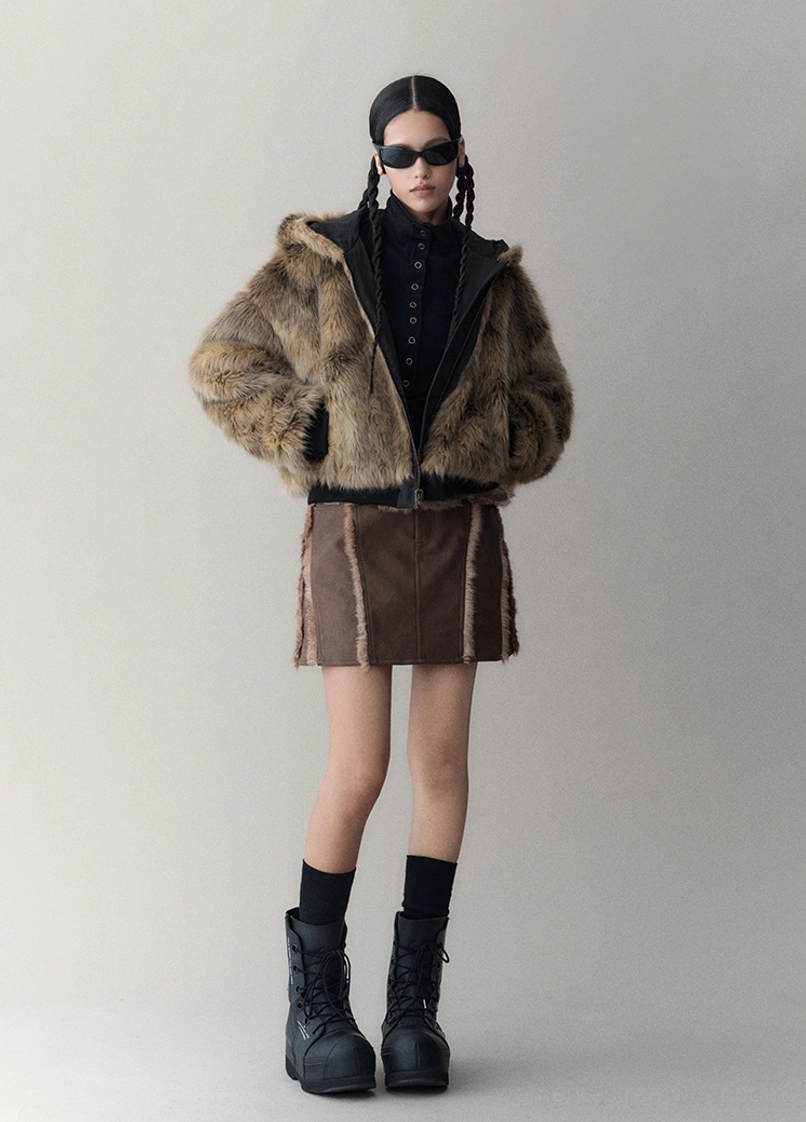 Reversible faux fur winter jacket product detail image highlighting the plush texture, attached hood, and contemporary Y2K streetwear design