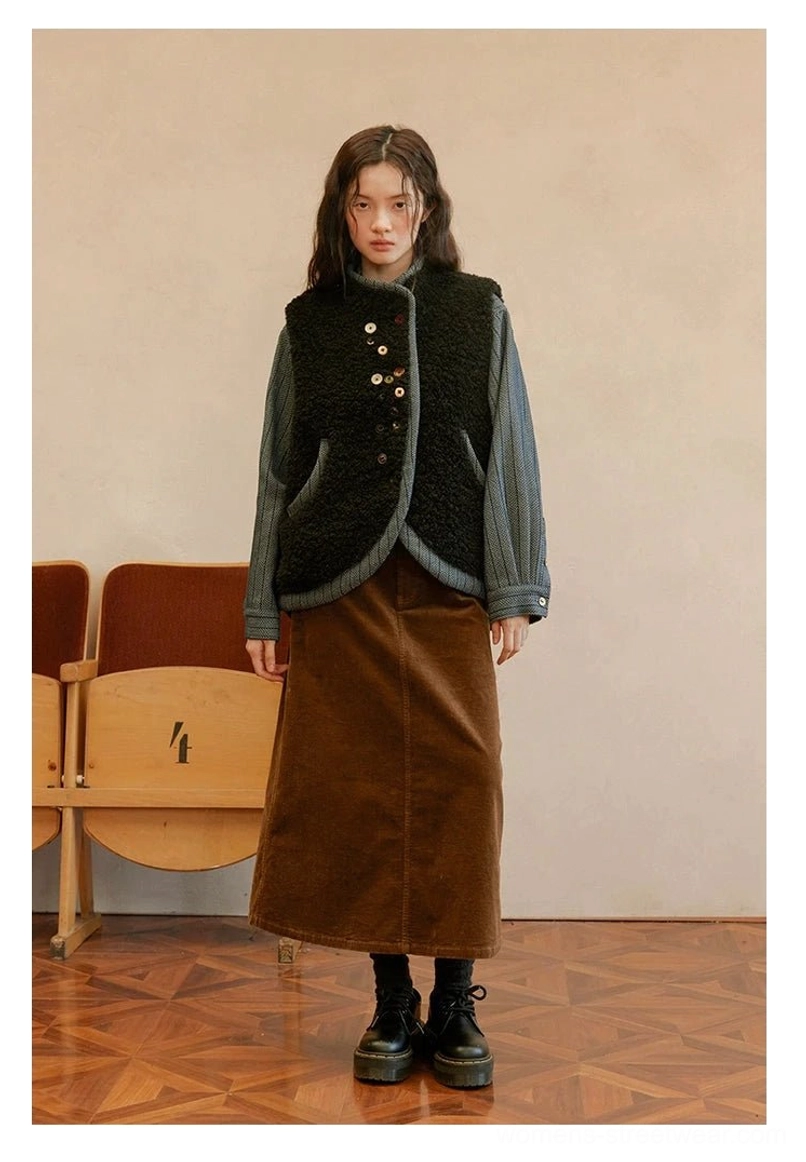 Reversible sherpa and denim vest product view showing the dual-sided construction and vintage-inspired color-block details
