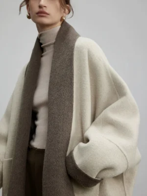 Off-white reversible two-tone wool silk oversized streetwear cardigan with brown contrast lapel and patch pockets front close-up