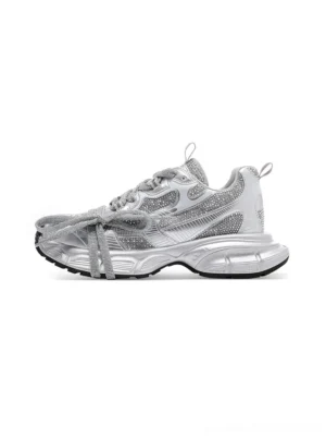 Silver rhinestone chunky dad sneakers with sparkling upper, dual lace details, and thick metallic sole on a white background