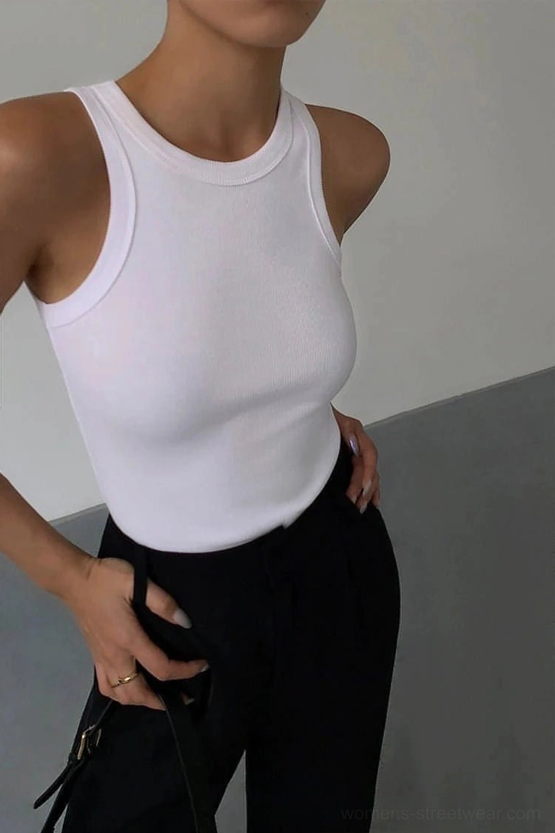 Ribbed knit tank top arm opening and sleeve detail showing wide sleeveless armhole construction