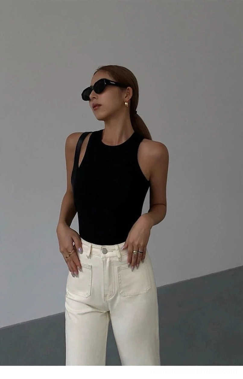 Ribbed knit tank top styled with minimal jewelry and accessories for clean aesthetic look