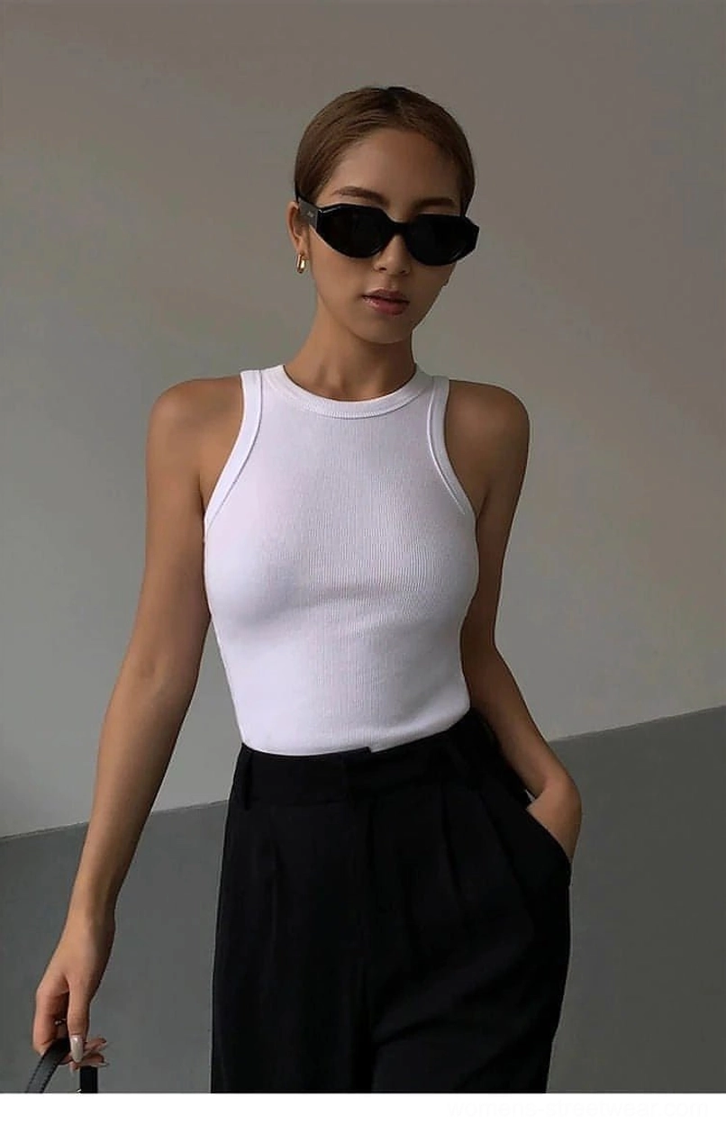 Multiple ribbed knit tank top color variations displayed together showing black white and neutral options
