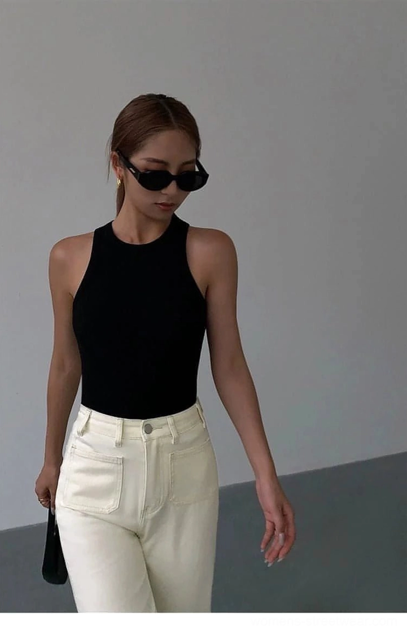 Ribbed knit tank top worn as standalone piece showing minimalist styling without additional layers
