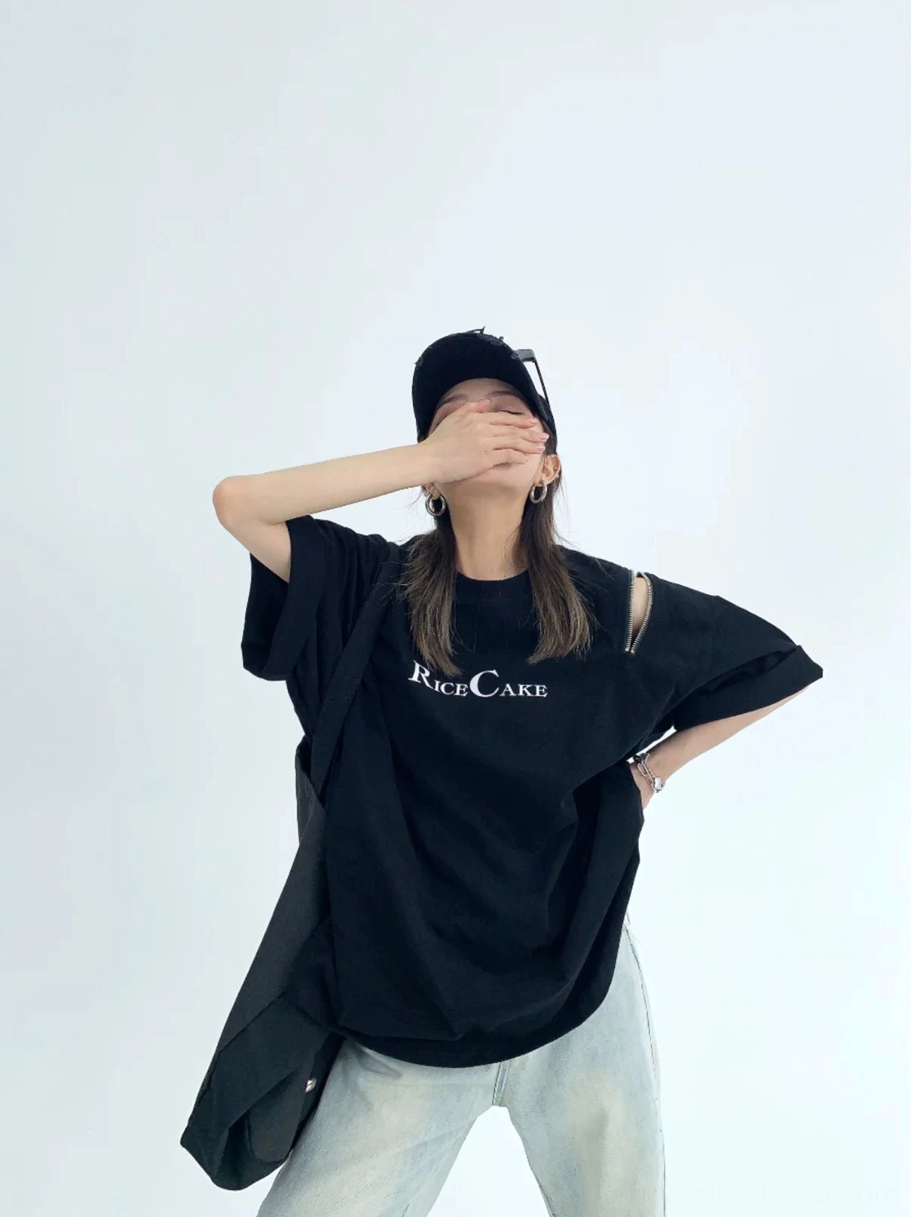 Black RICE CAKE zip shoulder cutout oversized graphic T-shirt styled with light wash jeans
