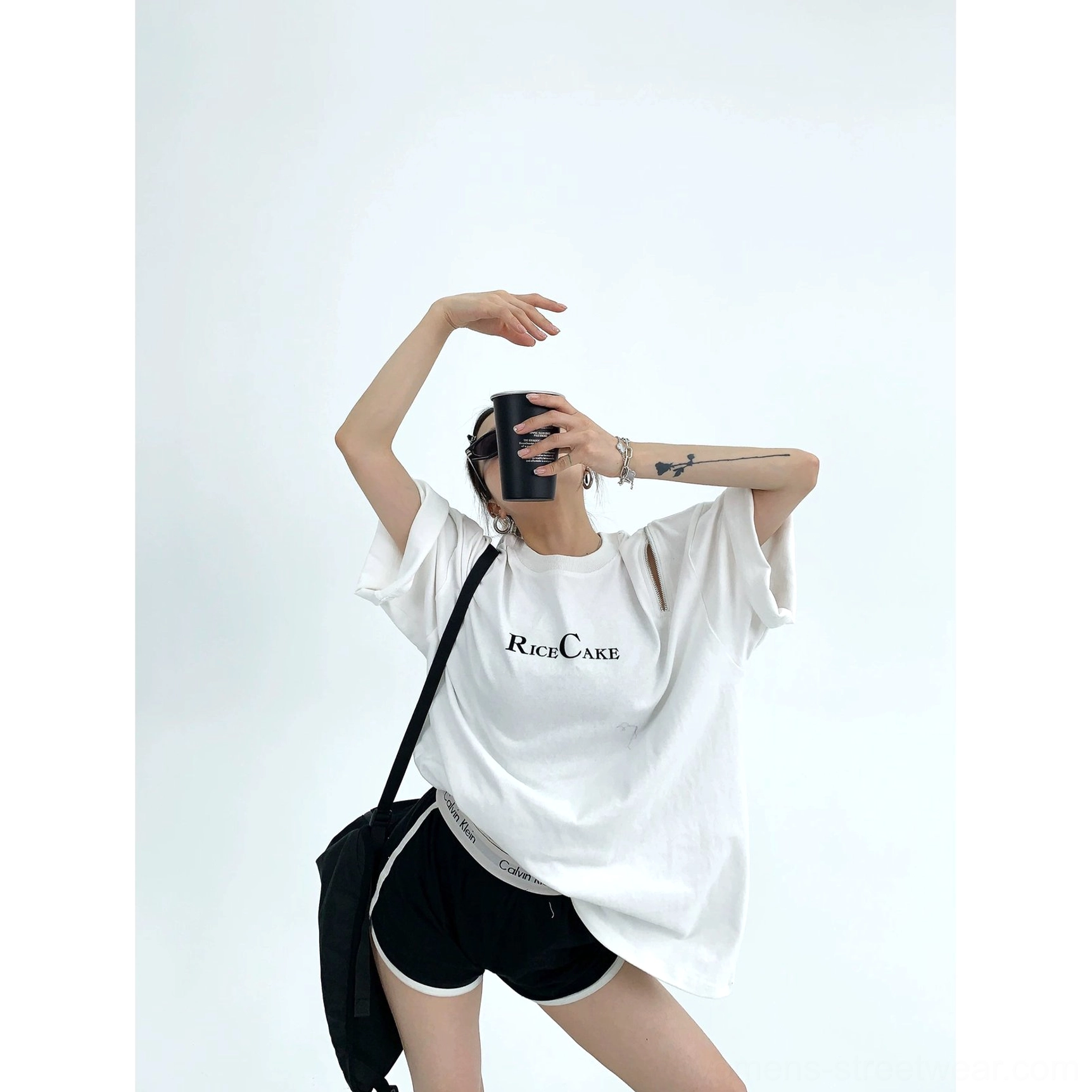 White RICE CAKE oversized streetwear tee with loose straight fit styled with black biker shorts