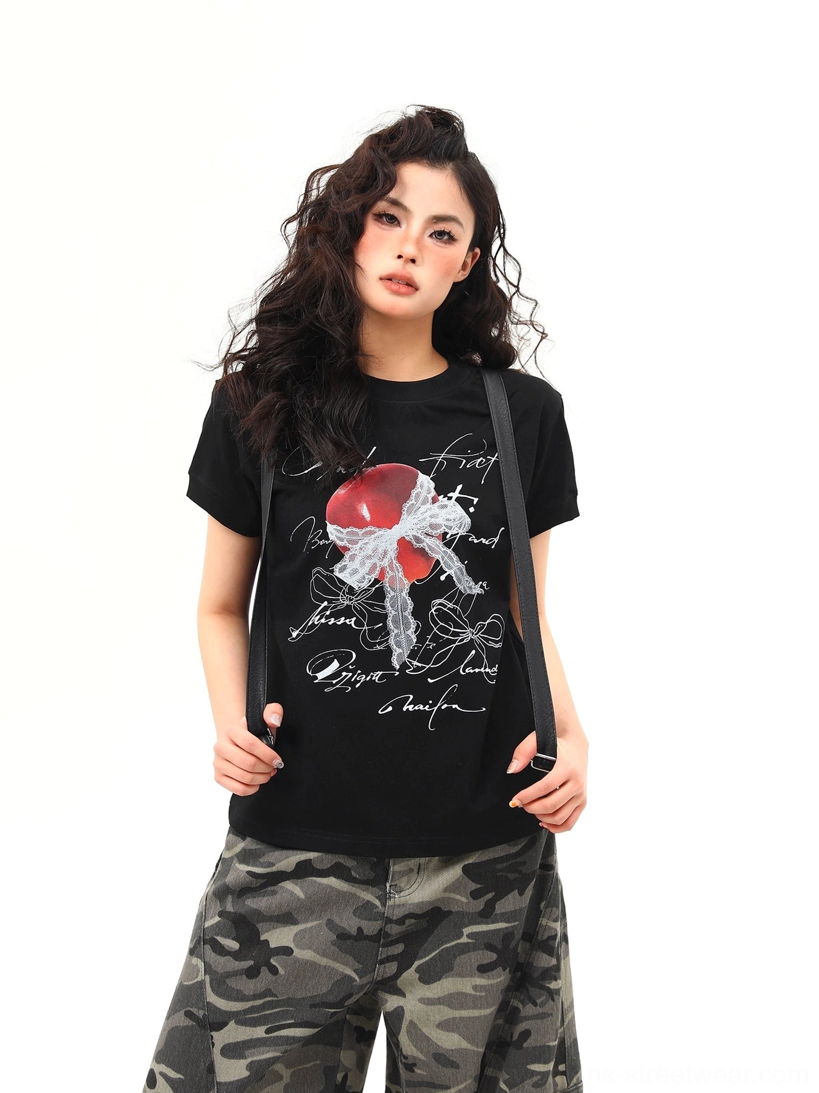 Close front view of black romantic heart and bow graphic T-shirt with handwritten script streetwear print