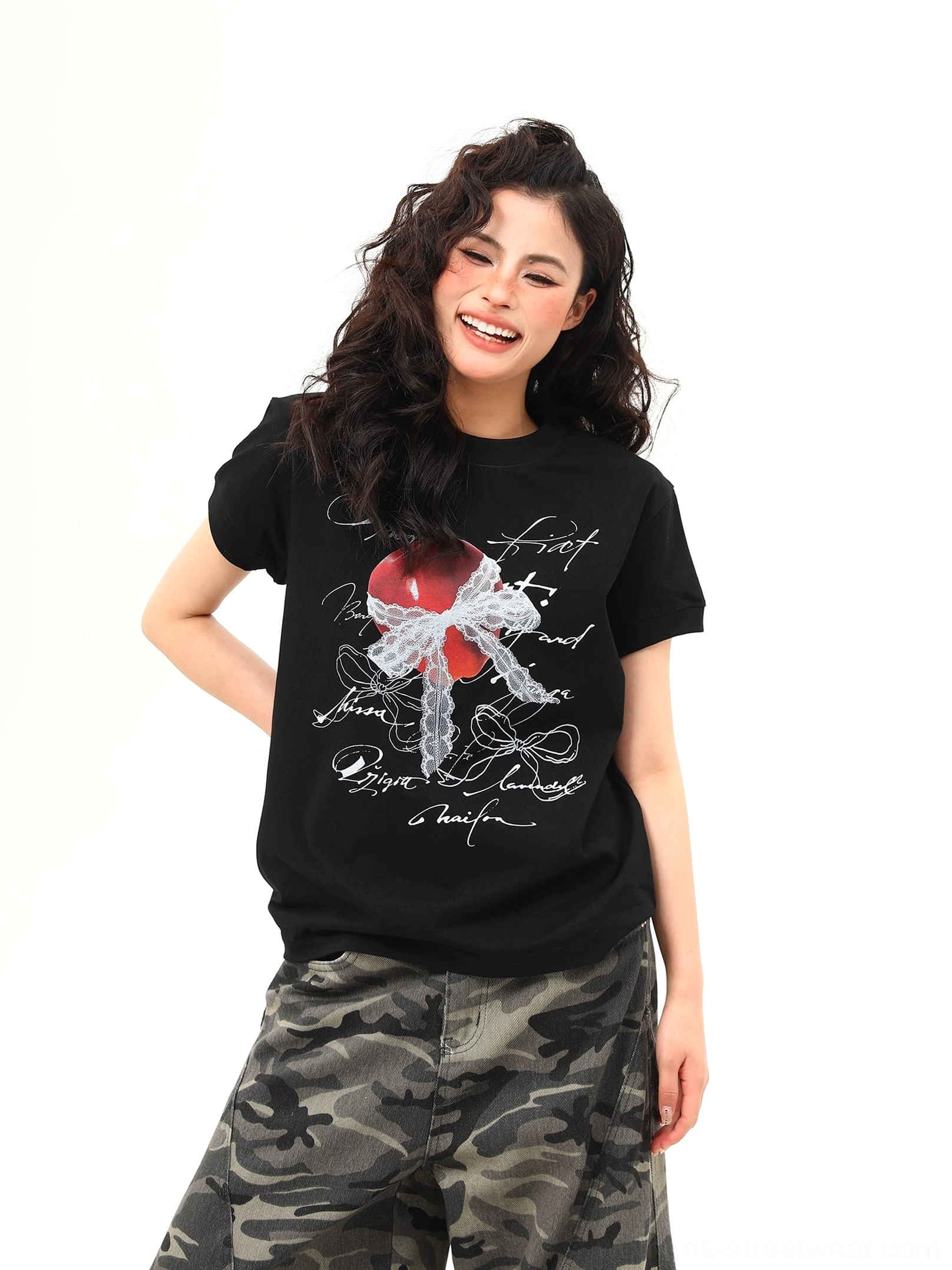 Black crewneck romantic graphic T-shirt featuring red heart lace-inspired bow and cursive script print
