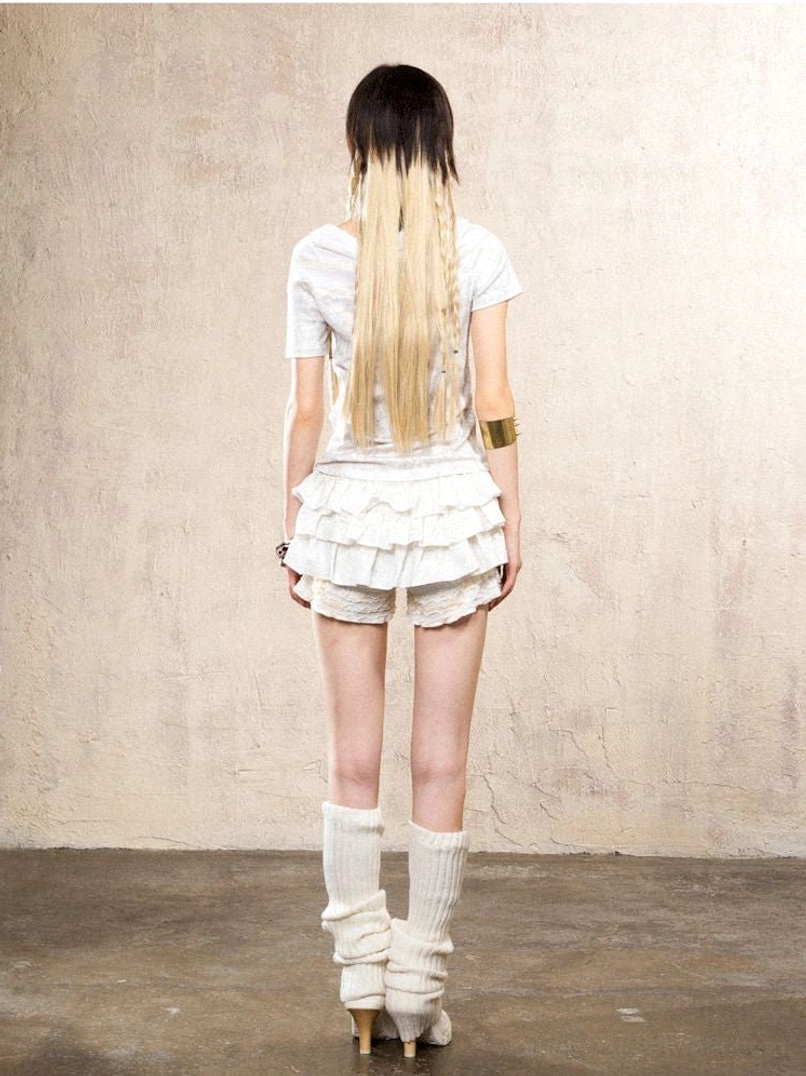 Romantic lace ruffle skort pants combining feminine details with edgy streetwear styling
