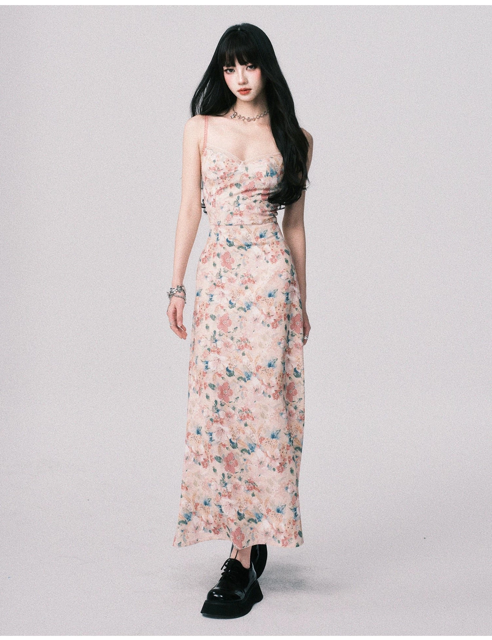Romantic pastel floral cami maxi dress with slim adjustable straps, soft watercolor fabric, fitted bodice, and flowing ankle length skirt