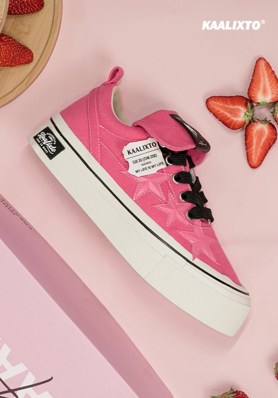 Rose pink canvas star sneakers with black lace contrast and white platform-inspired rubber soles for Y2K streetwear looks