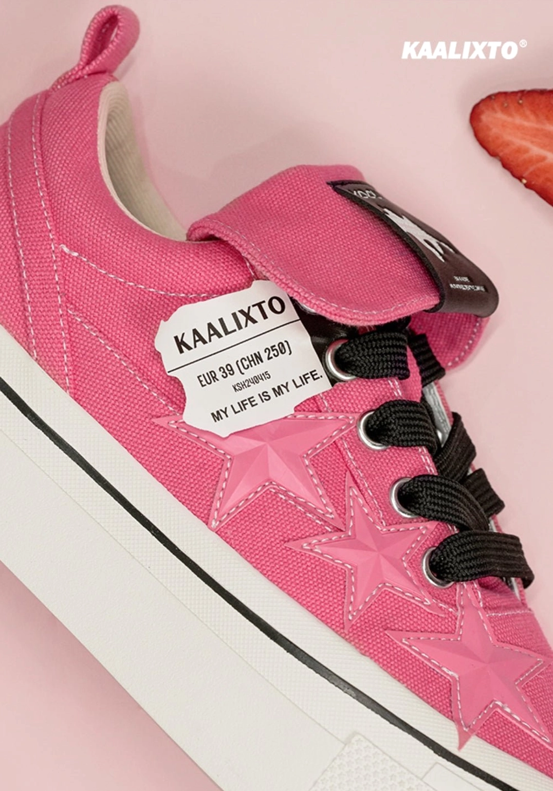 Rose pink canvas star sneakers with fold-over tongue strap detail and durable textured rubber outsole