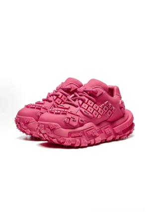 Rose pink chunky keyboard sneakers shown from a front three quarter angle with raised key inspired details and a thick rugged platform sole