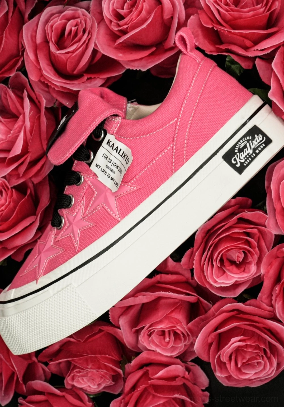 Rose pink low-top star canvas platform sneakers with black and white contrast details for women and unisex styling