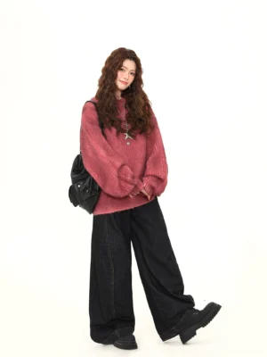 Rose red fuzzy knit oversized sweater shown from a three-quarter angle with relaxed crew neck and loose streetwear fit