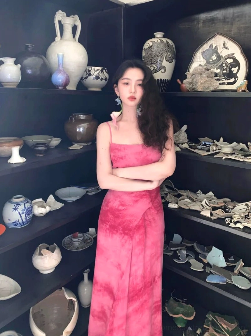 Rose Red tie-dye spaghetti strap maxi dress with square neckline, wrap waist sash, fitted bodice, and floor-length draped skirt styled in a vintage indoor setting
