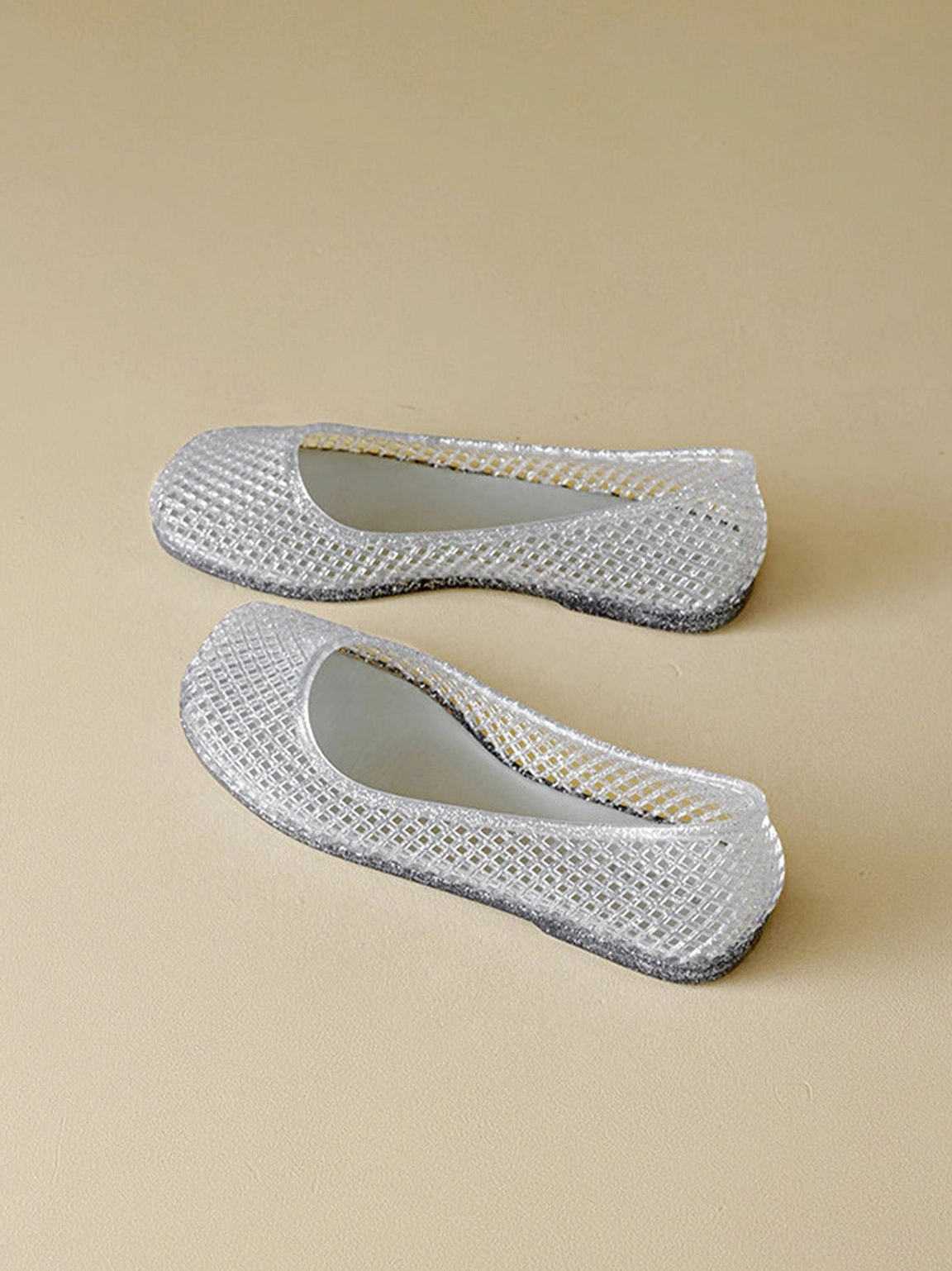 Rounded toe glitter mesh jelly ballet flat with translucent woven upper and casual streetwear appeal