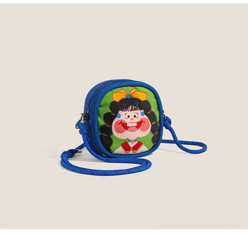Royal blue cartoon girl crossbody bag with pigtail character artwork zipper edge and adjustable cord strap