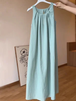 Dusty blue sleeveless halter maxi dress with gathered neckline and loose flowing A-line silhouette on hanger