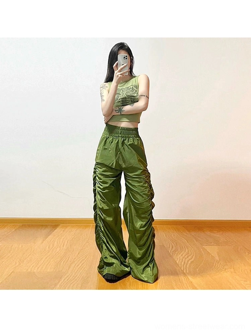 Ruched high-waist wide-leg streetwear cargo pants with relaxed silhouette, gathered side detailing, and glossy finish