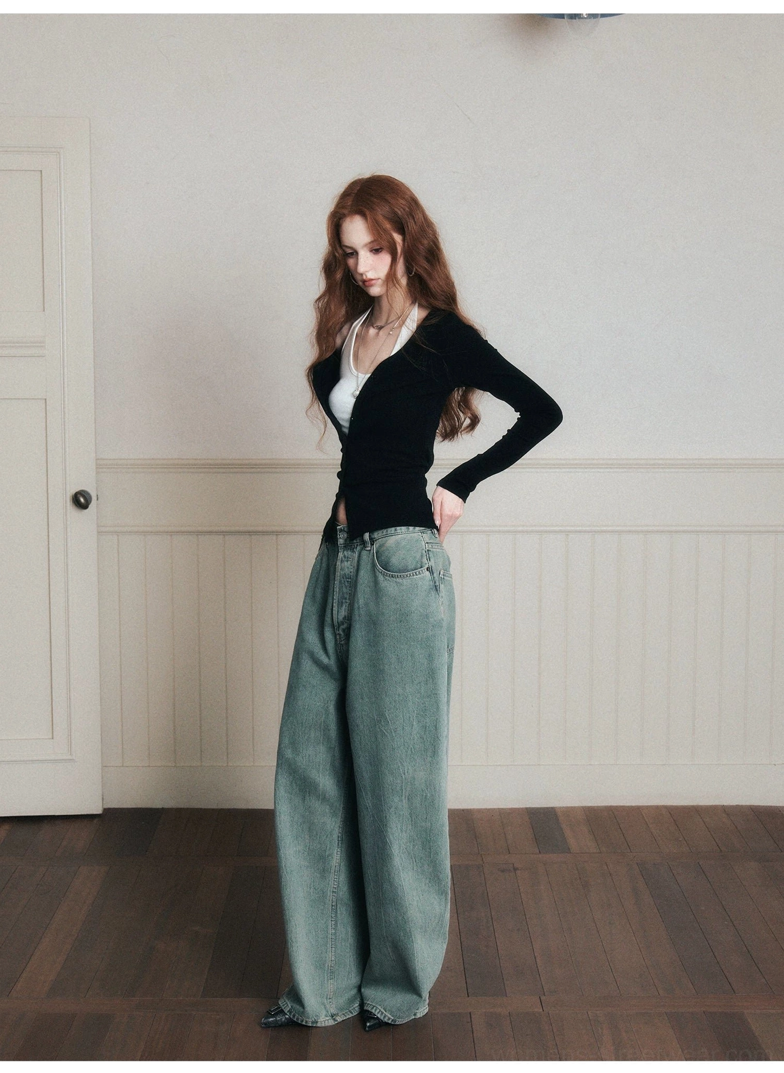 Black ruched layered knit cardigan and halter top set shown in a three-quarter side pose