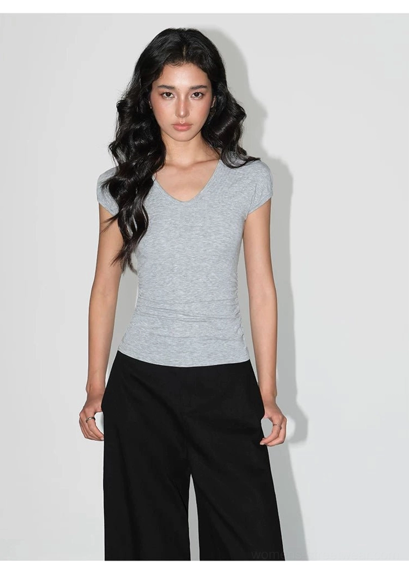 Ruched V-neck sculpting knit baby tee for women highlighting the flattering neckline and fitted shape