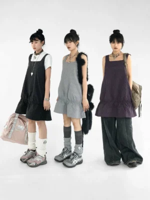 Berry black and gray gingham ruffled pinafore mini dresses layered over white t shirts in Korean streetwear styling