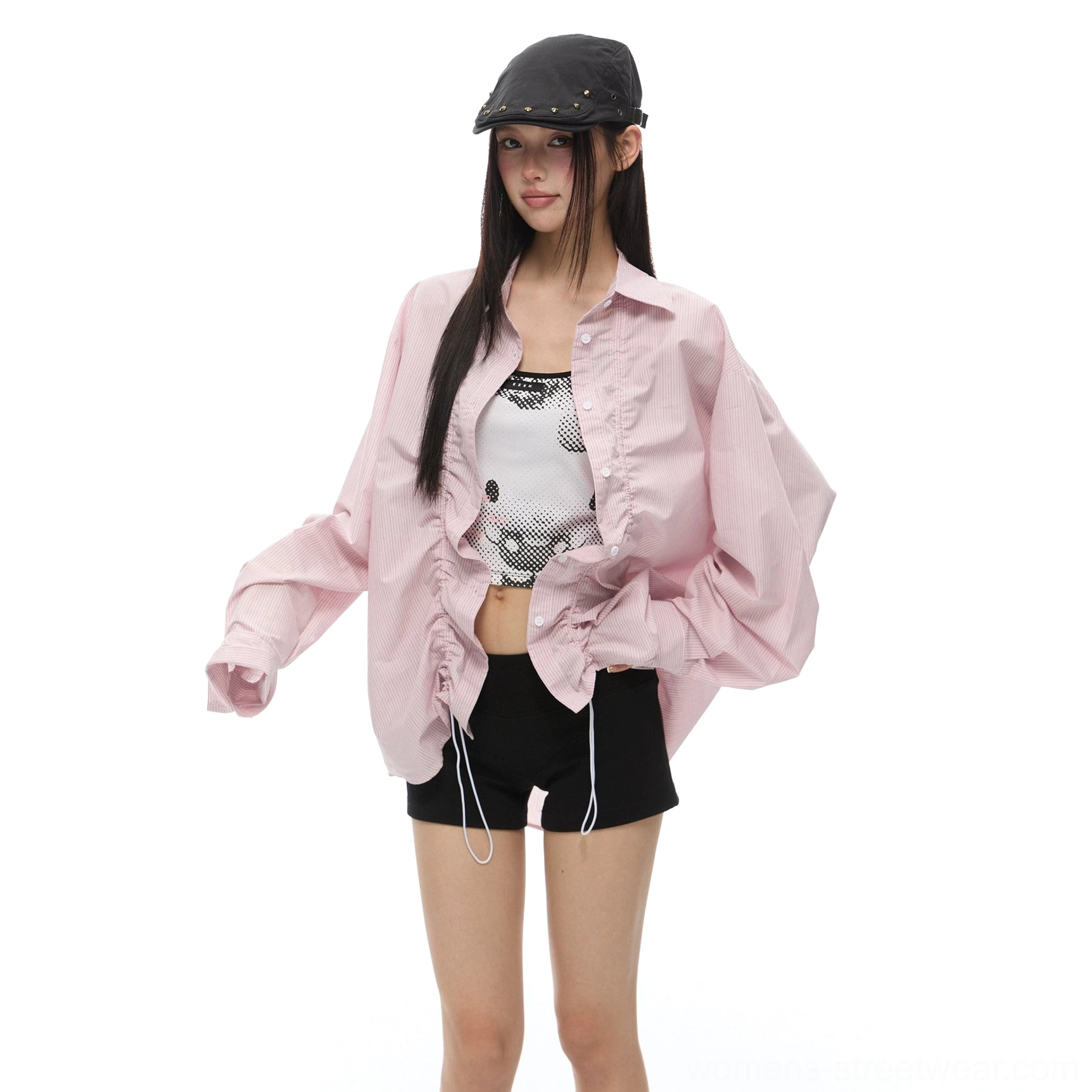 Solid pink ruffled oversized long sleeve shirt with ruched drawstring front styled with a printed camisole and black shorts